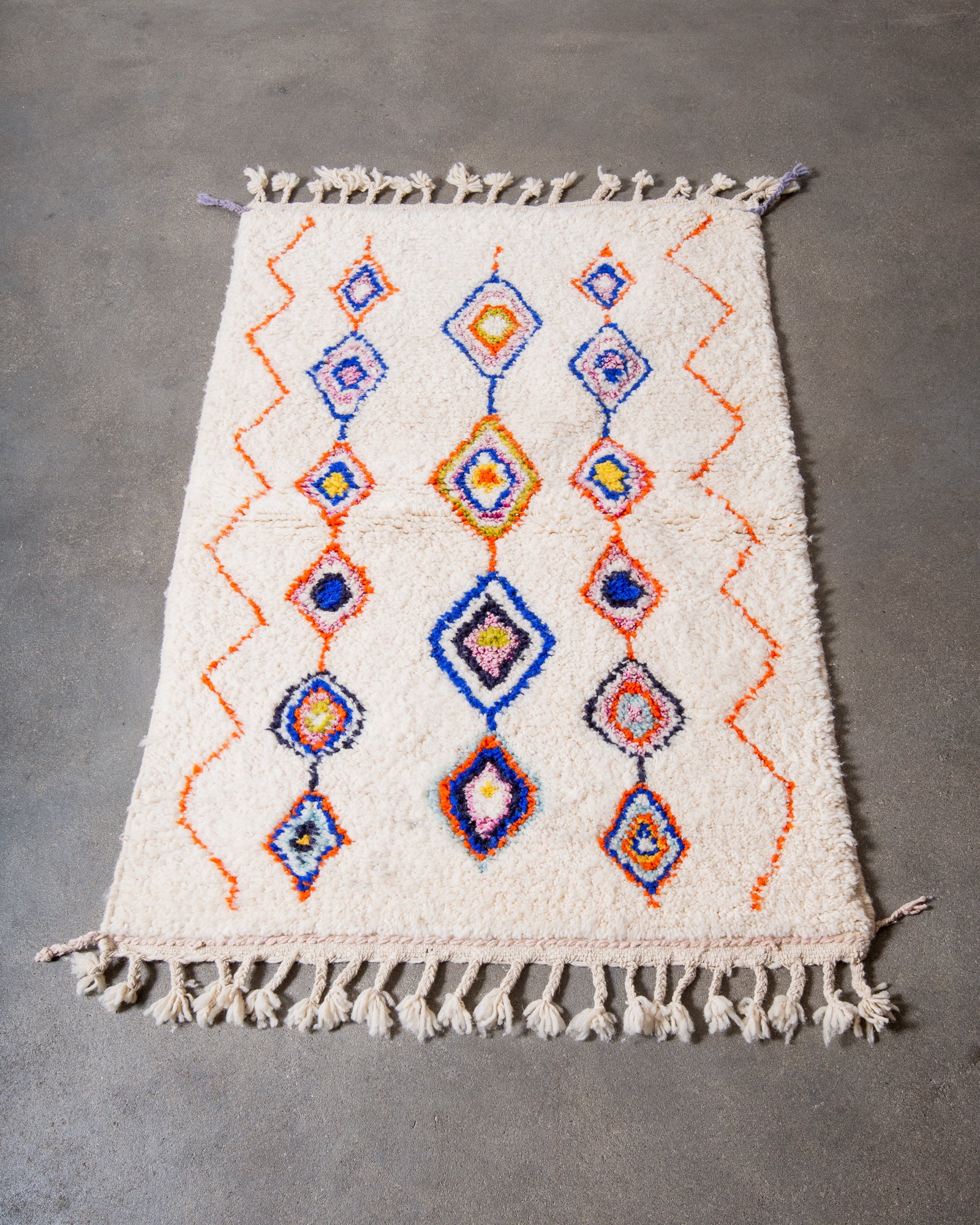 Modern, designer, handcrafted Berber rug from Morocco. Beniourain carpet with beautiful colours and patterns and fluffy wool texture.